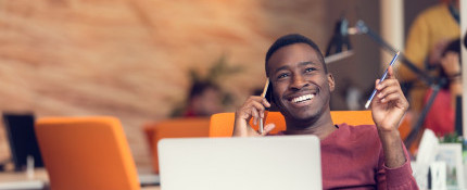 Colleague smiling and chatting on mobile phone