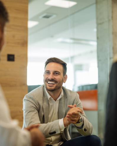 Male colleague chatting in the workplace